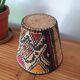 Ethnic basket in multicolored braided straw