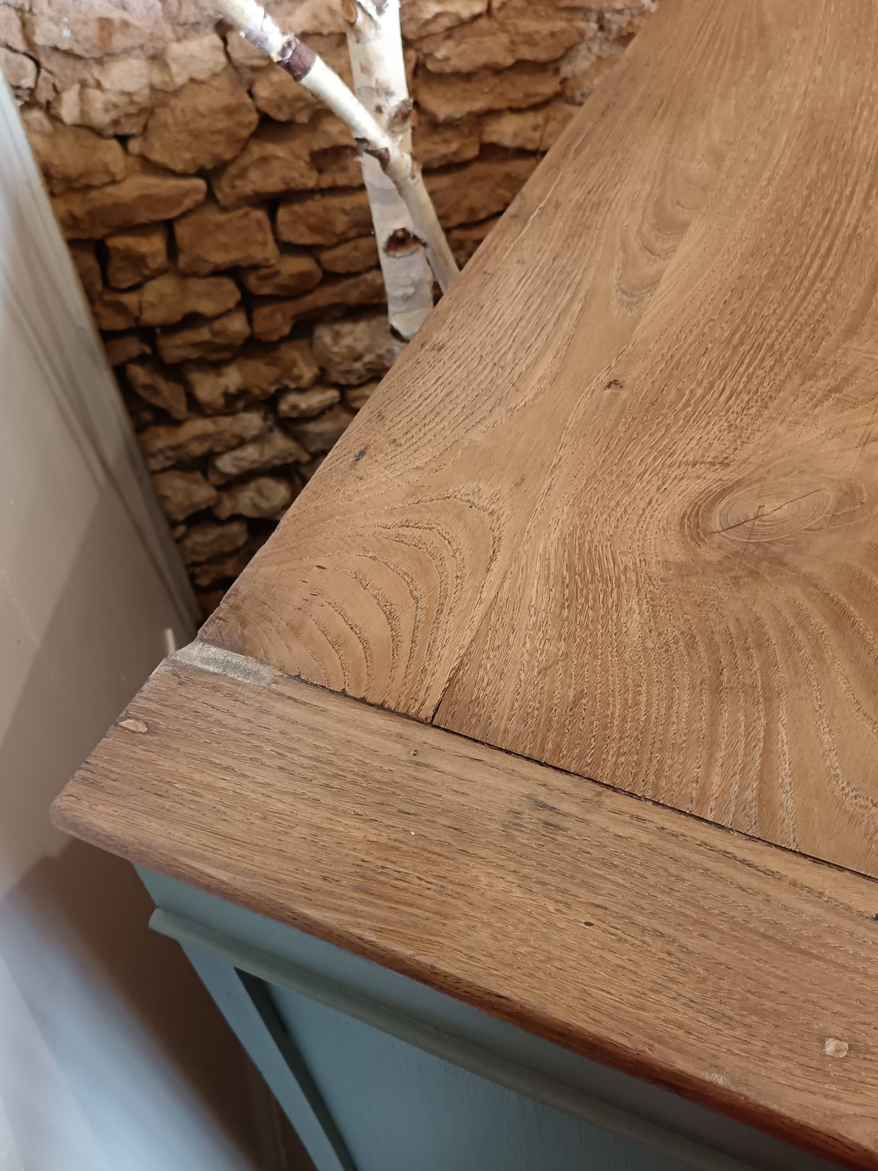 Buffet made of natural wood and bronze green.