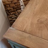 Buffet made of natural wood and bronze green.