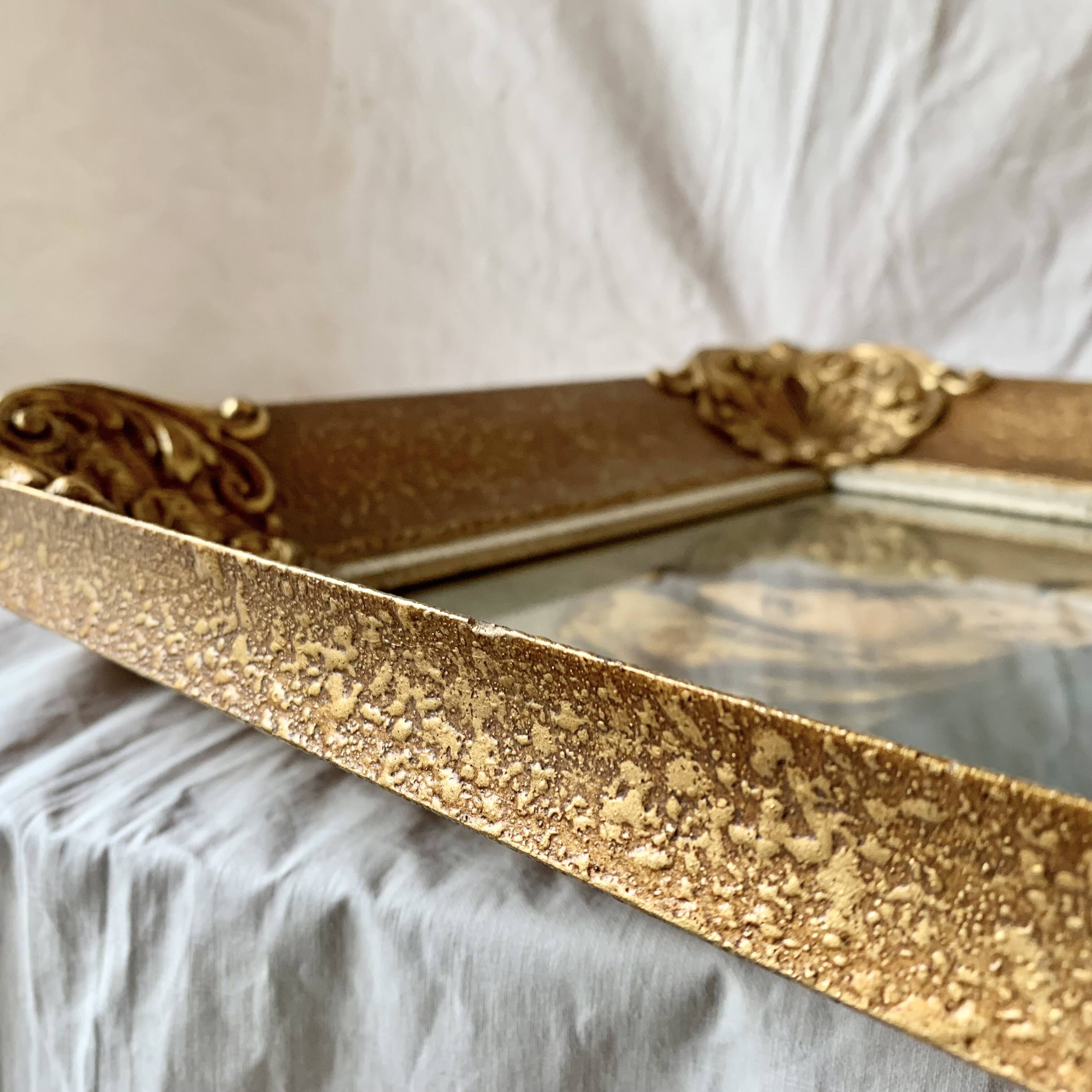 Old wall frame in carved gilded wood