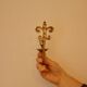 A pair of antique brass wall sconces.