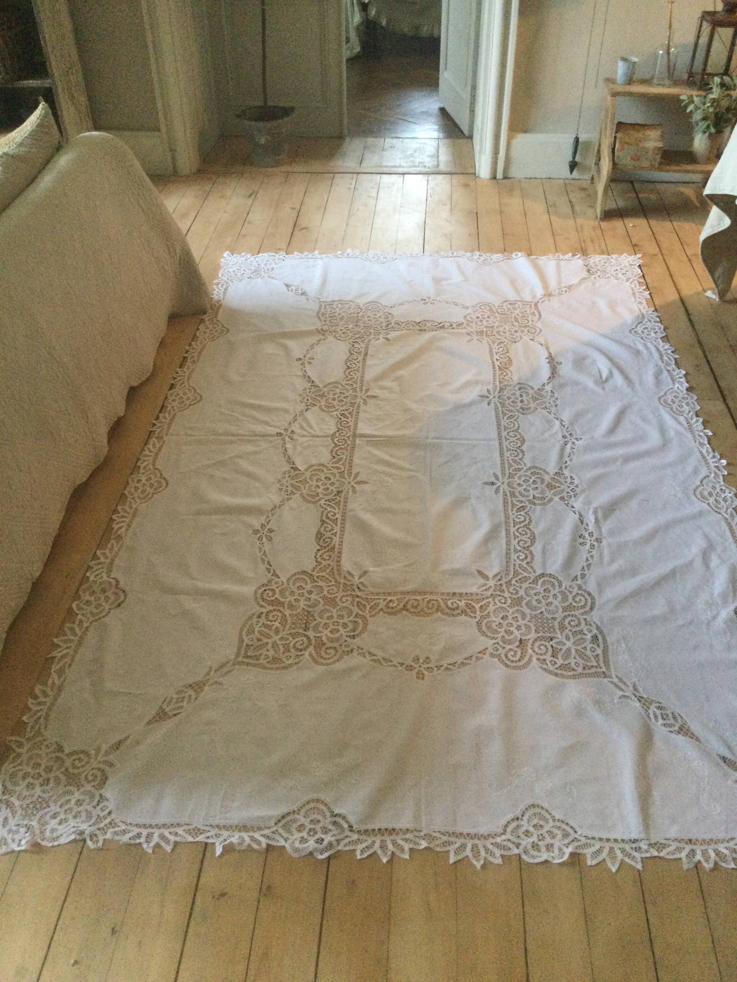 Embroidered white tablecloth and lace