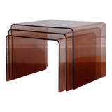 Vintage trio of nesting tables in smoked plexiglass by Michel Dumas, year.