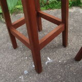 Two wooden artist stools in the early 20th century