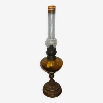 Antique kerosene lamp with yellow glass