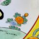 Yellow porcelain plate with saturated and vivid colors. Handmade in Japan