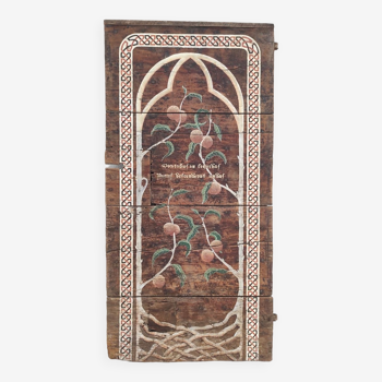 Old door with decorative Art Nouveau painting