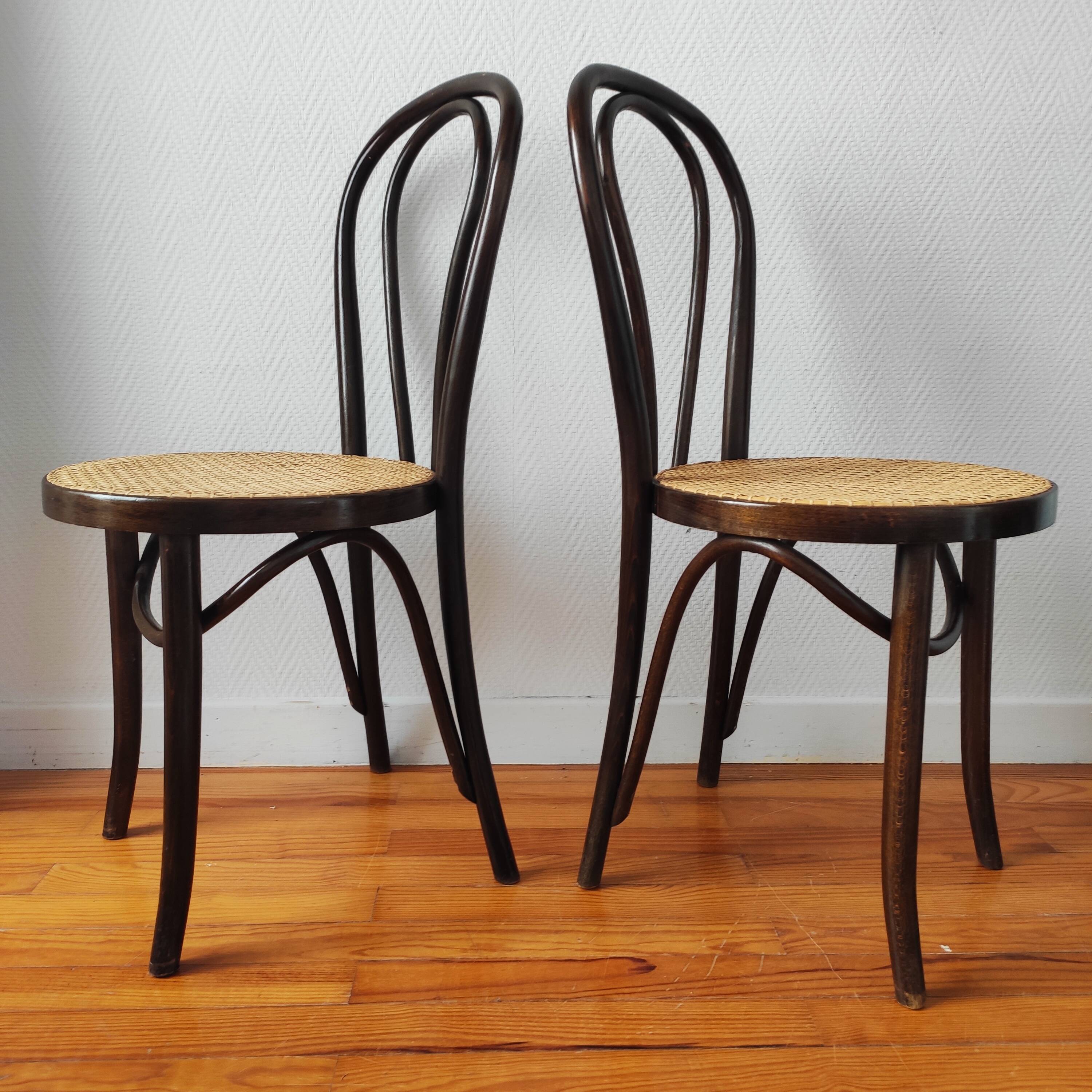 4 antique curved wood and cane chairs
