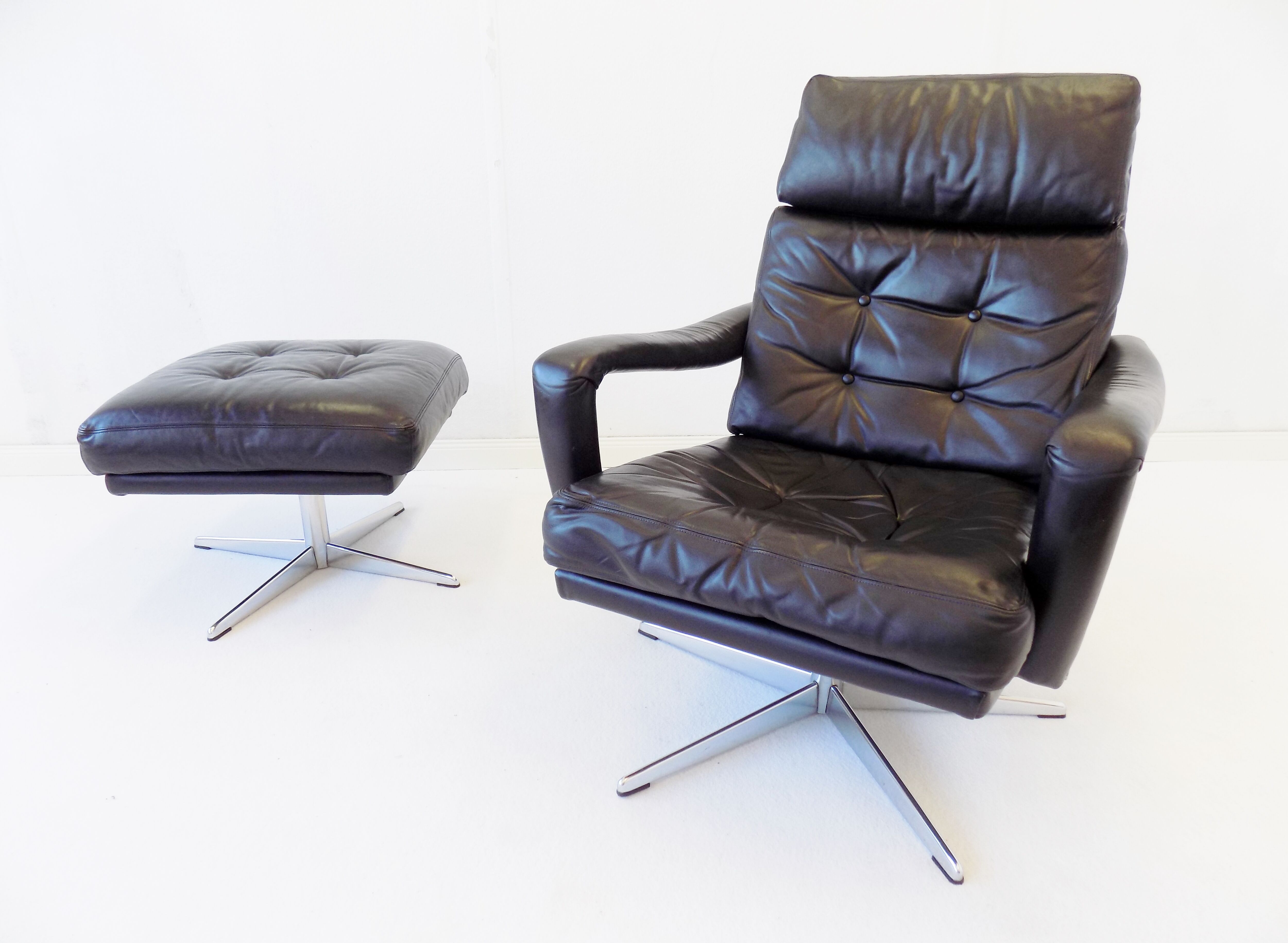 Danish black leather armchair with ottoman 70s