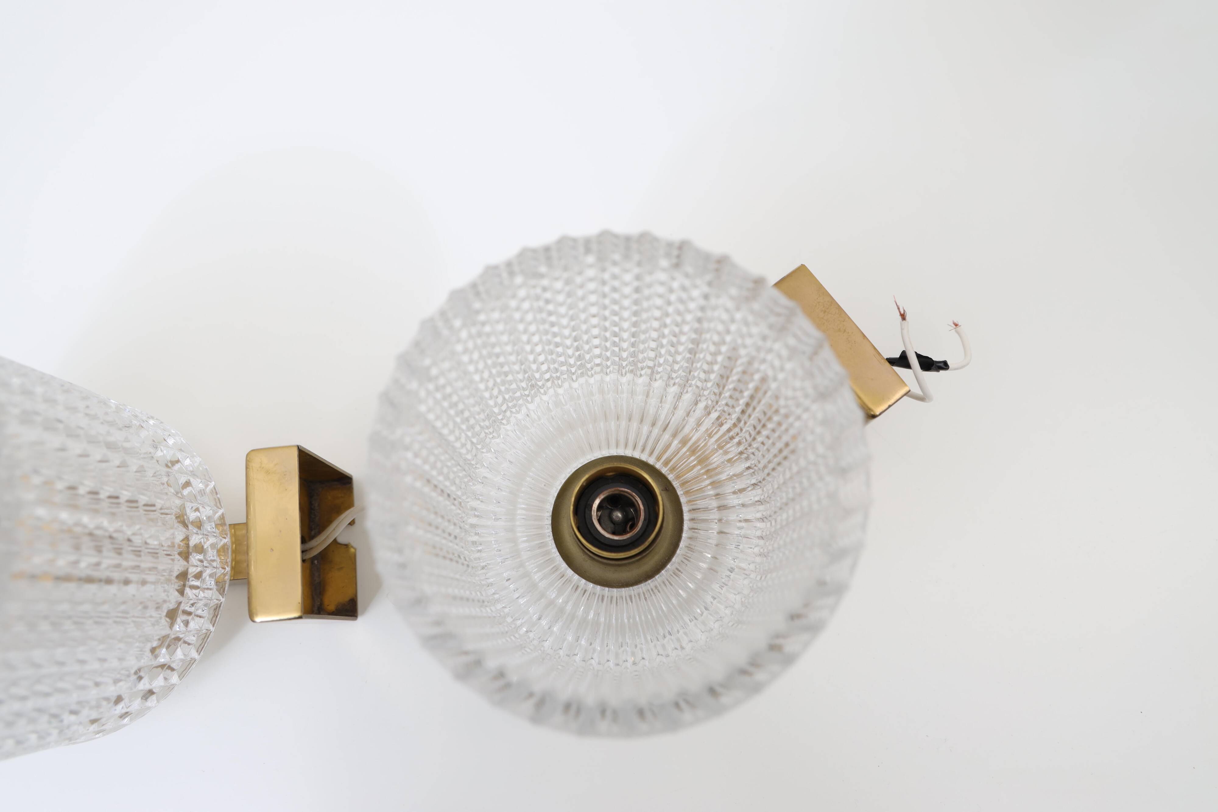Carl Fagerlund for Orrefors Pair of wall lights in brass and glass Sweden 1960