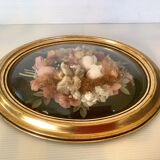 Golden oval frame dried flowers