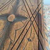 Low stool in carved wood