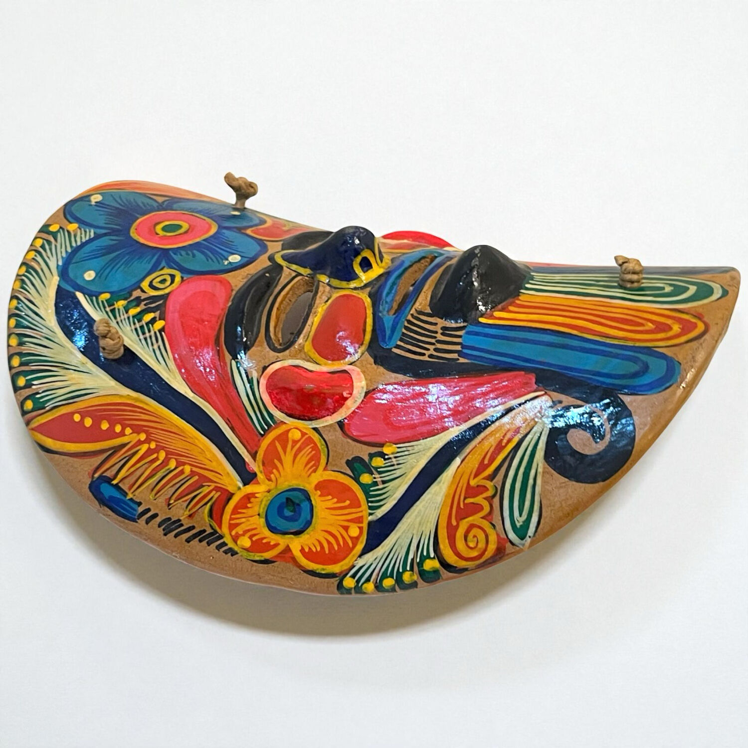 Mexican folk art mask in colored terracotta, 1970s