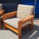 Brutalist-style bench and armchairs in 1970s pine.
