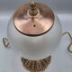 Hollywood Regency bedside lamp in gold metal with a glass globe.