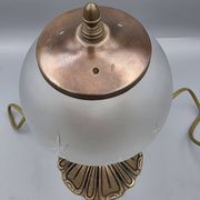 Hollywood Regency bedside lamp in gold metal with a glass globe.