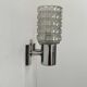 Pair of vintage wall lights, chromed metal and pressed molded glass, Italy, 1970