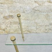 End of sofa, glass and twisted legs in gilded metal