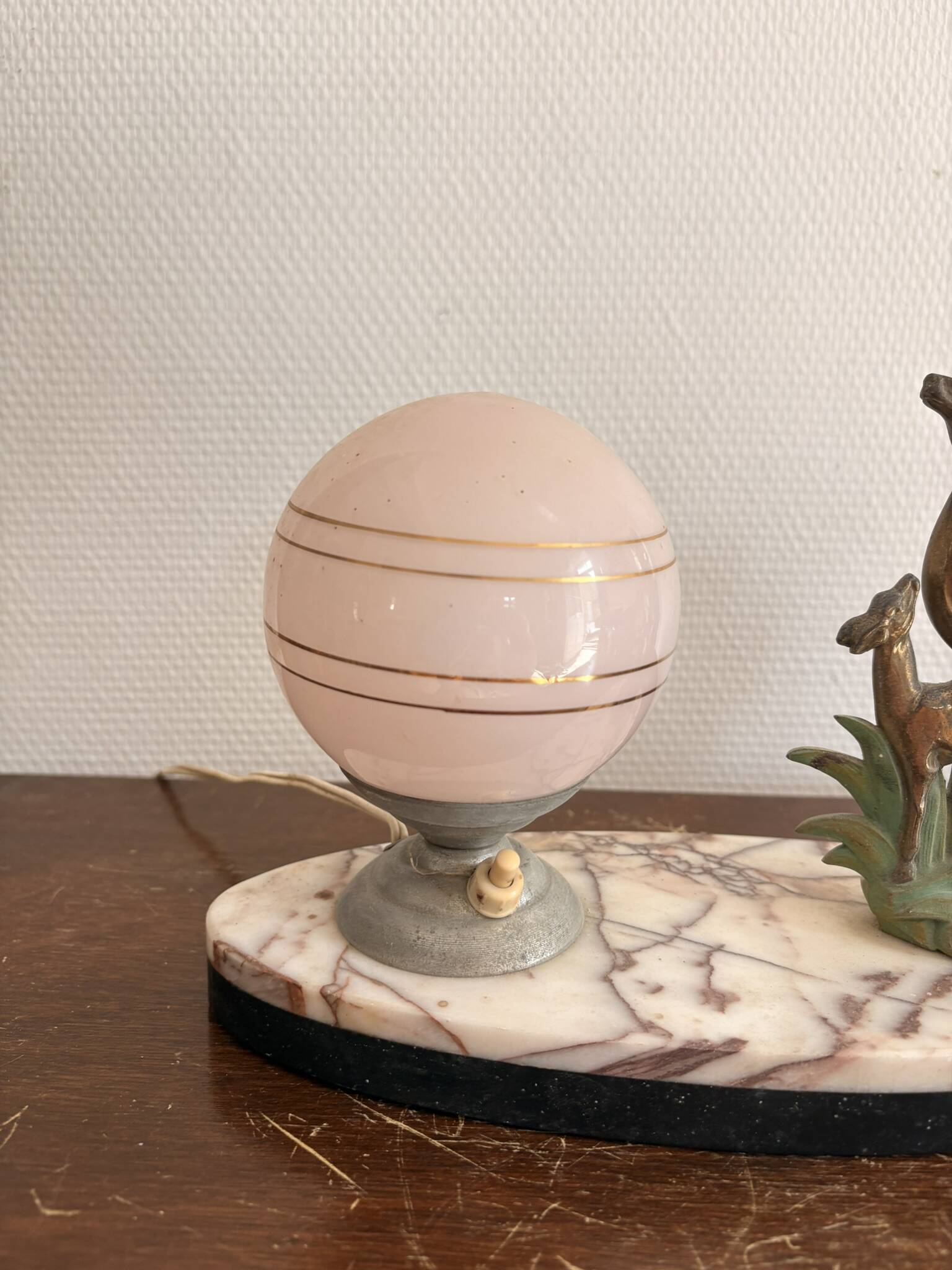 Antique Art Deco table lamp in marble and pink glass featuring a deer.