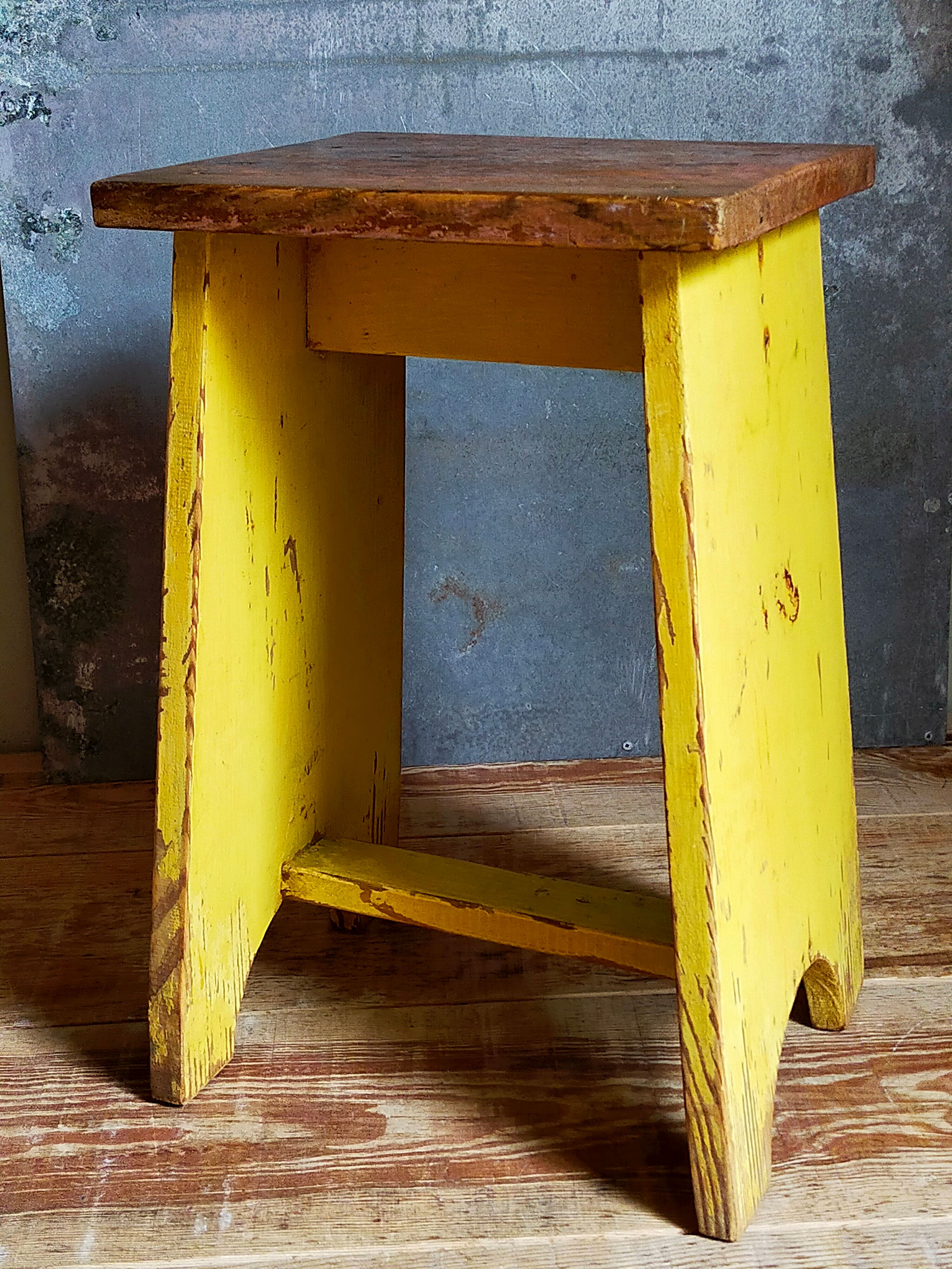 Art-populaire workshop stool in patinated wood