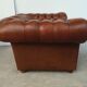Brown leather chesterfield armchair