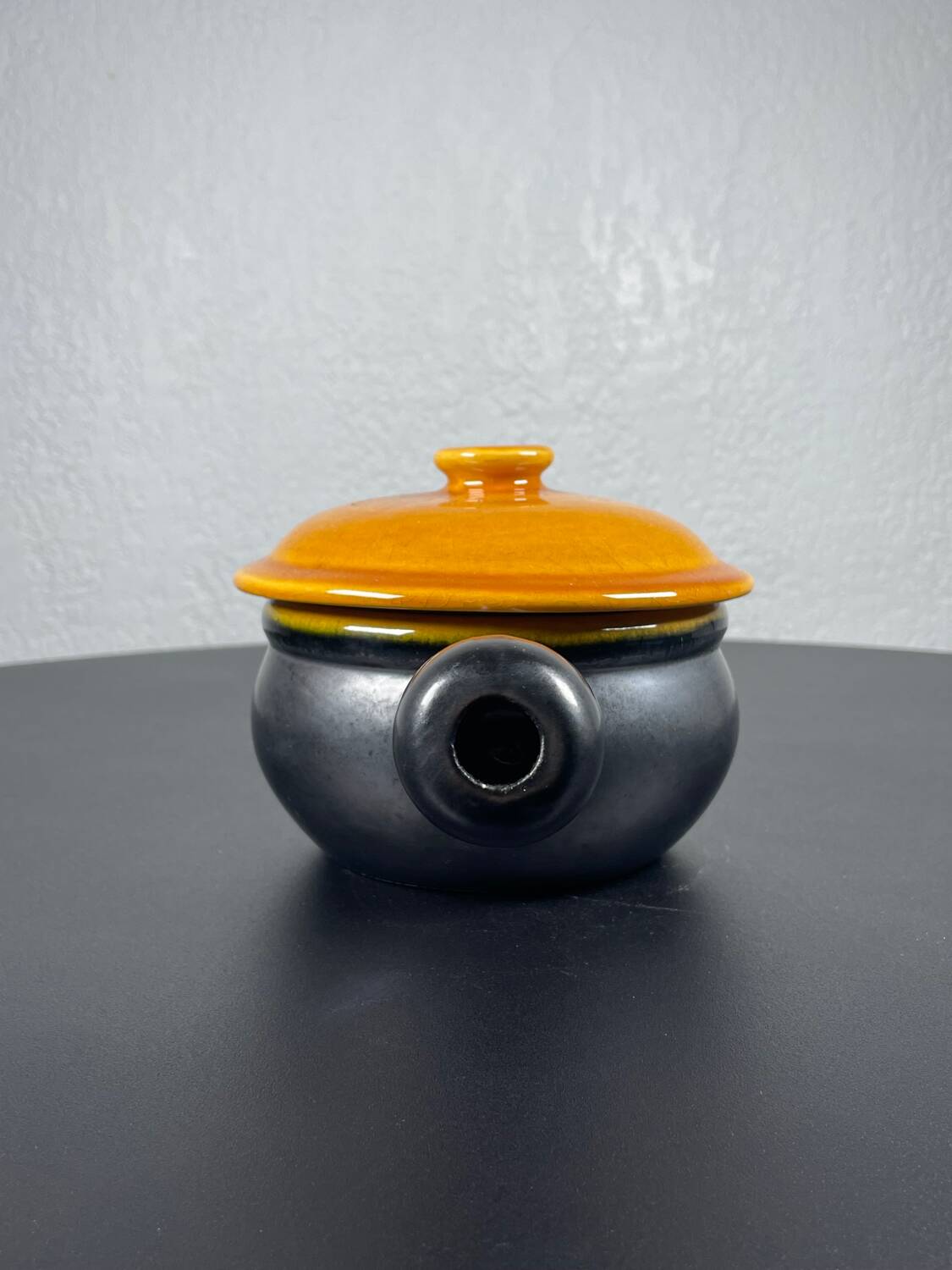 Black and yellow fondue pot