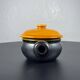 Black and yellow fondue pot