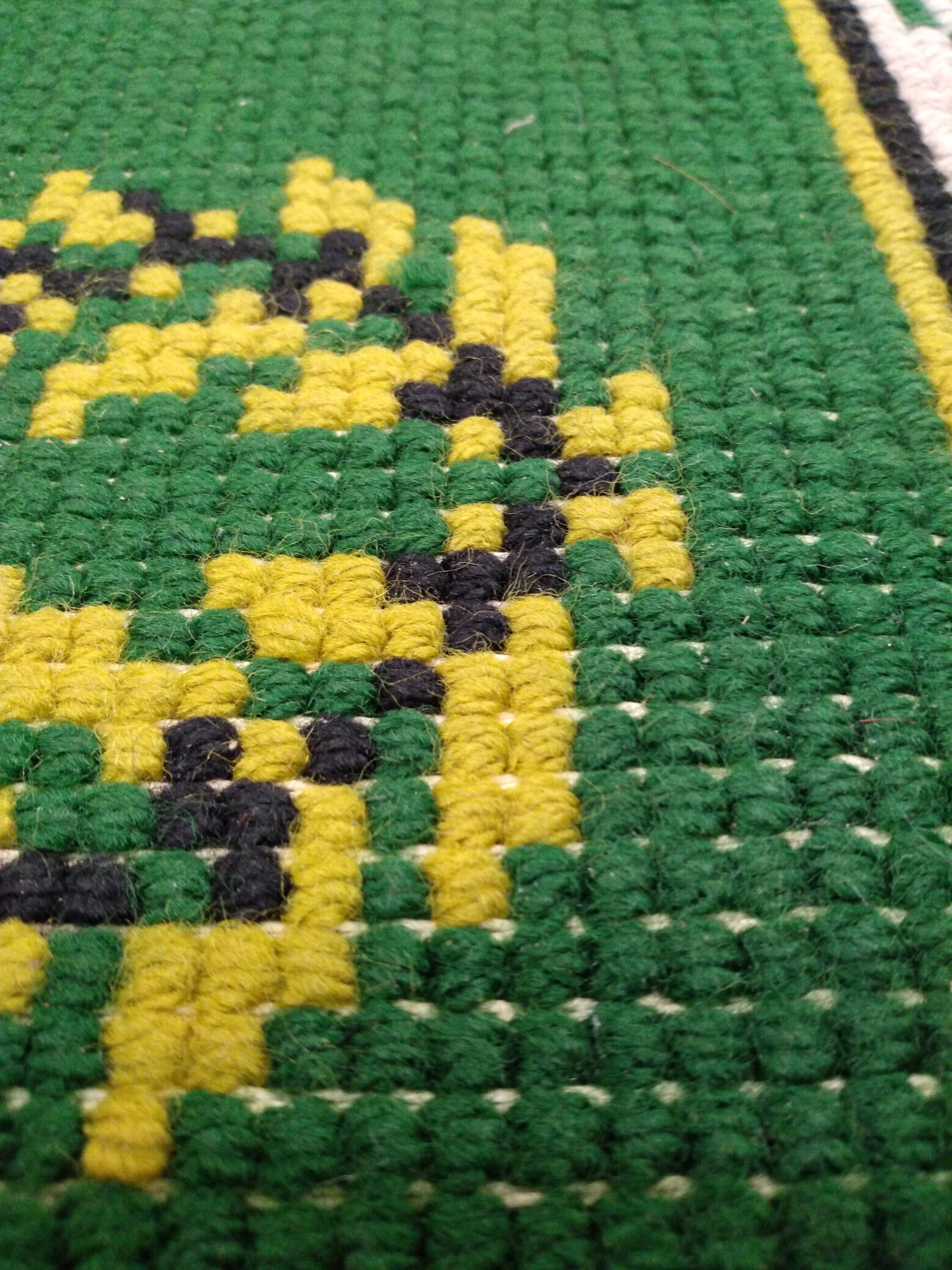 Antique green Berber rug
