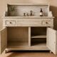 Antique wooden bathroom cabinet with painted finish and white marble.