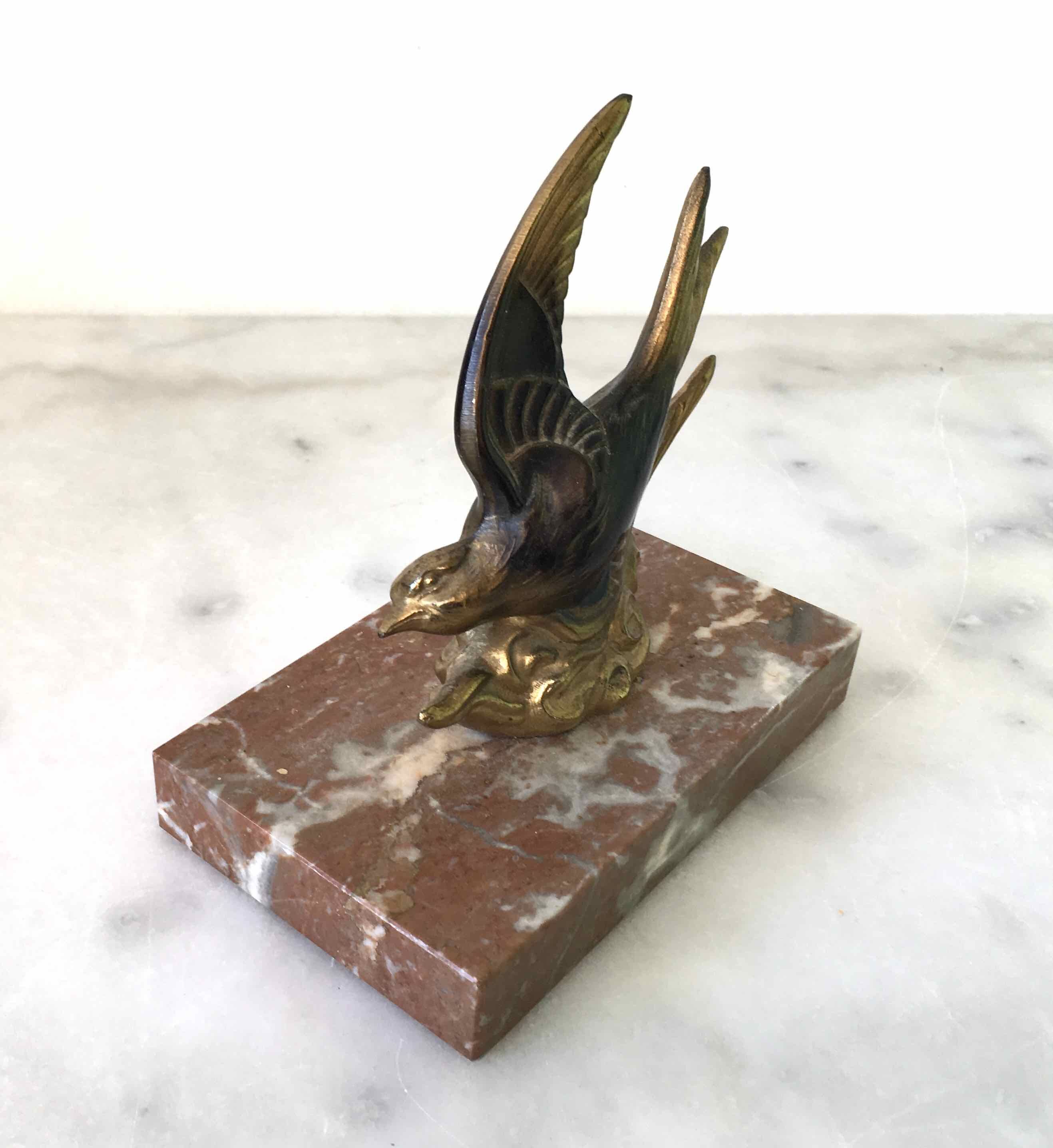 Marble swallow and brass paperweight