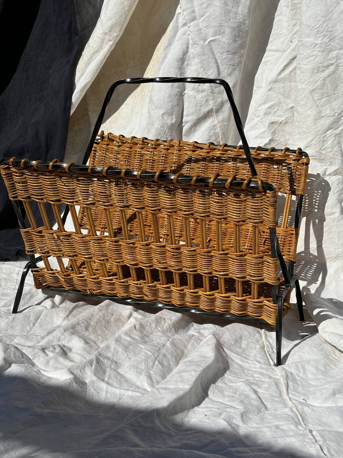 Vintage metal and wicker magazine rack