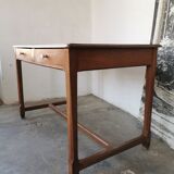 Table in raw oak, countryside.