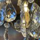 Three-light chandelier in bronze and cut crystal, early 20th century work.