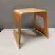 Beautiful design stool/side table made of curved plywood and designed by Lisa Norinder for Ikea.