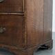 Antique English oak commode dating from the late 18th century.