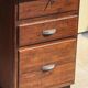 Modernist desk in wood and green moleskin upholstery