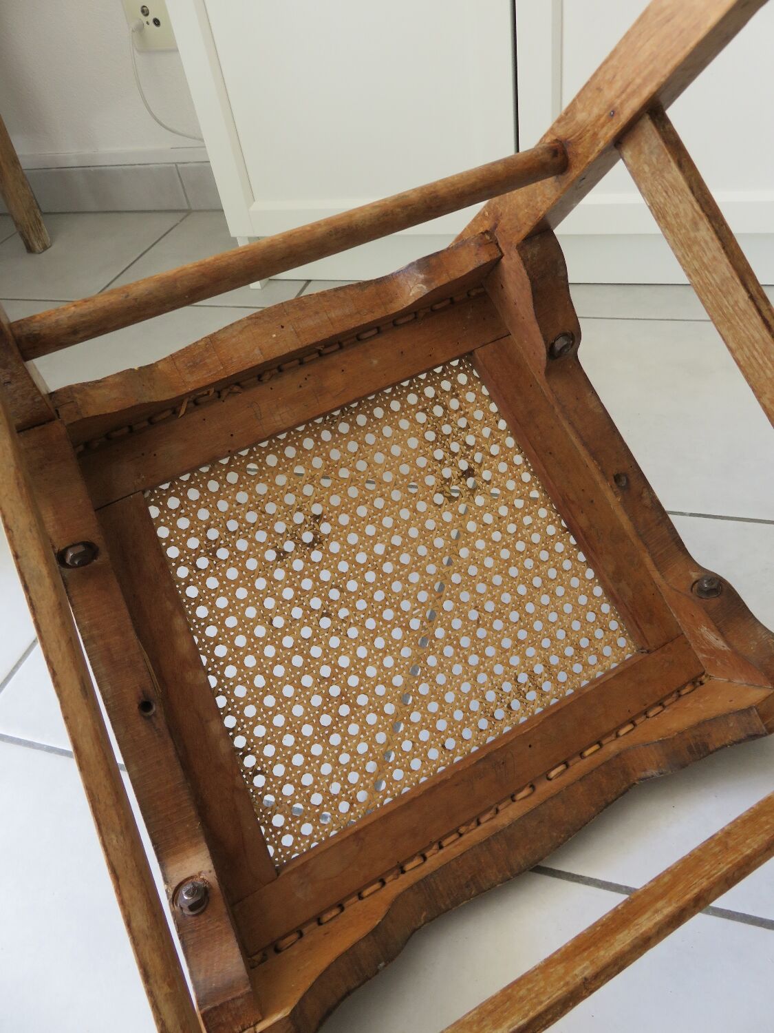 Antique solid wood chair with caning, country house style.