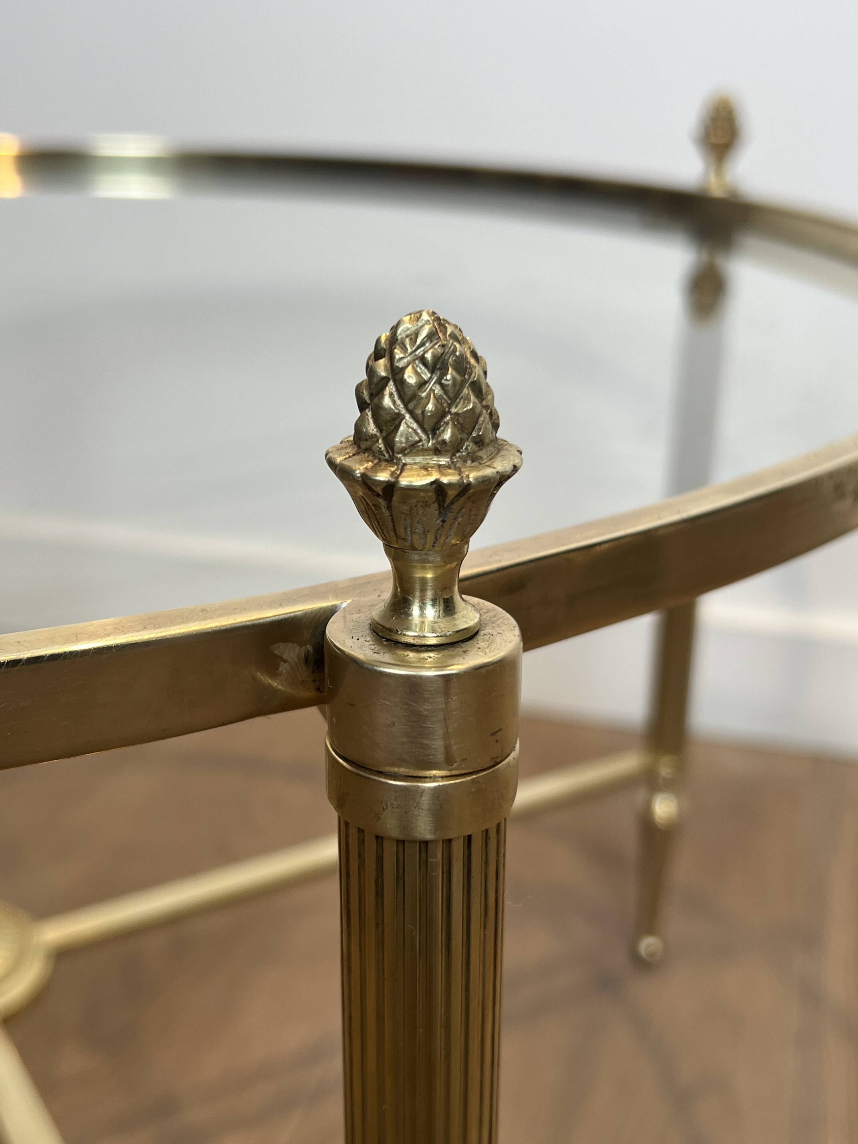 Neoclassical Round Coffee Table in Brass with Fluted Supports and Floral Motifs