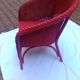 Fauteuil vintage en rotin rouge