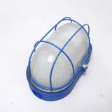 Blue industrial wall or ceiling light.