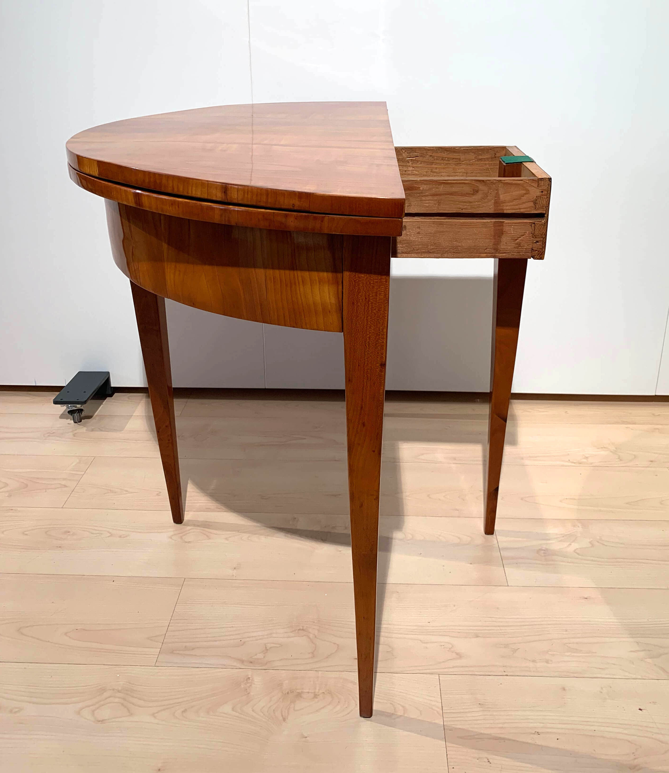 Biedermeier demi-lune fold-out table, cherry veneer, south germany, circa 1820