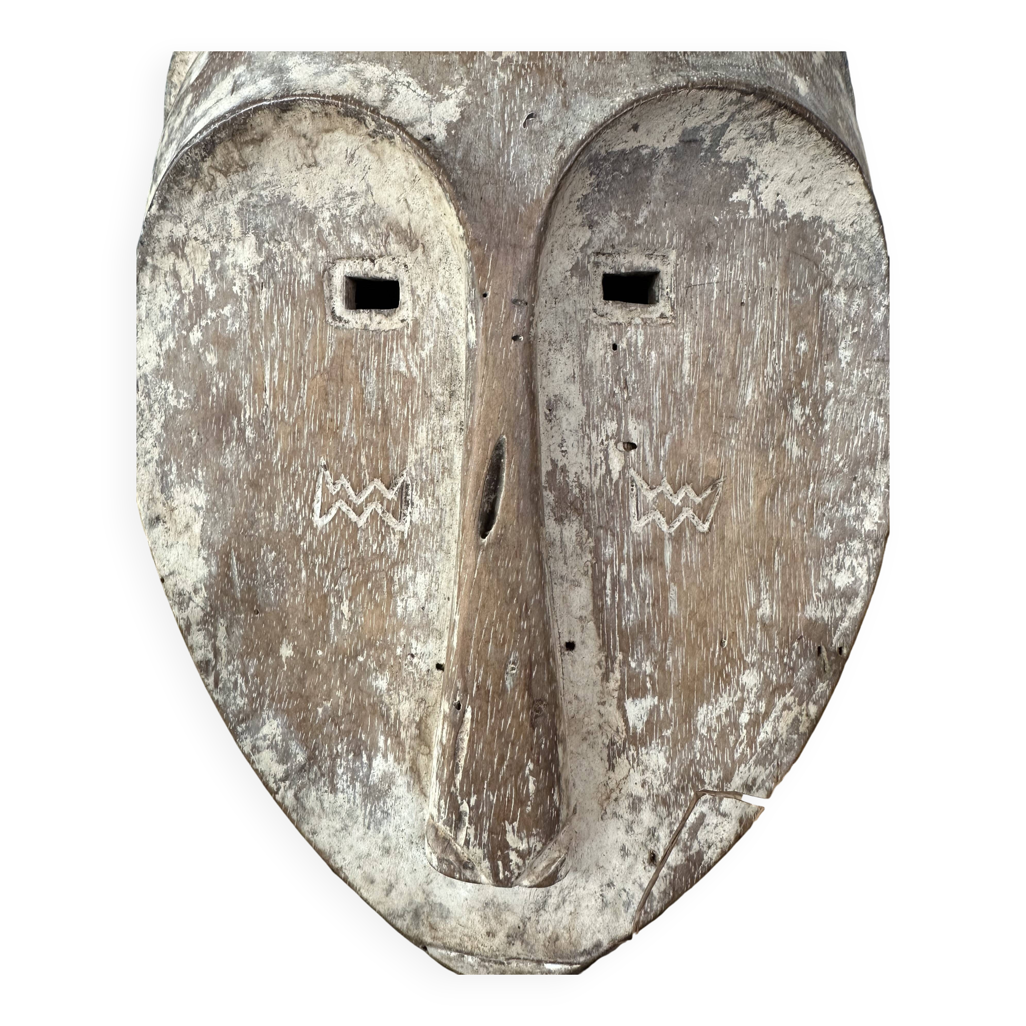 Long face tribal mask with narrow eye-holes