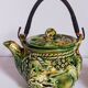 Set of old teapots and honey pot