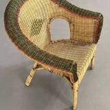 Rattan and wicker cabriolet-style armchair with green and red edging