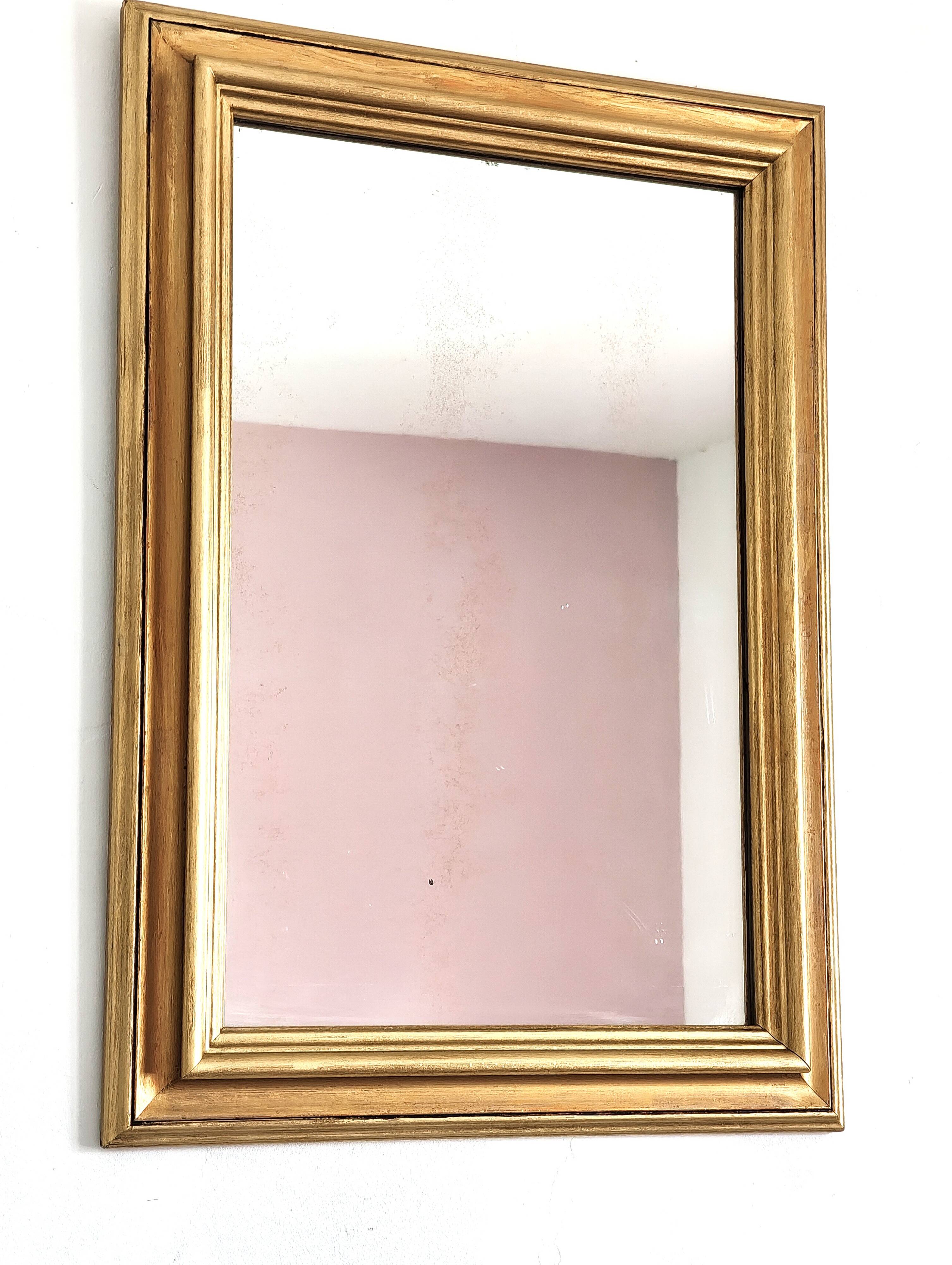Miroir ancien en bois doré et cuivré