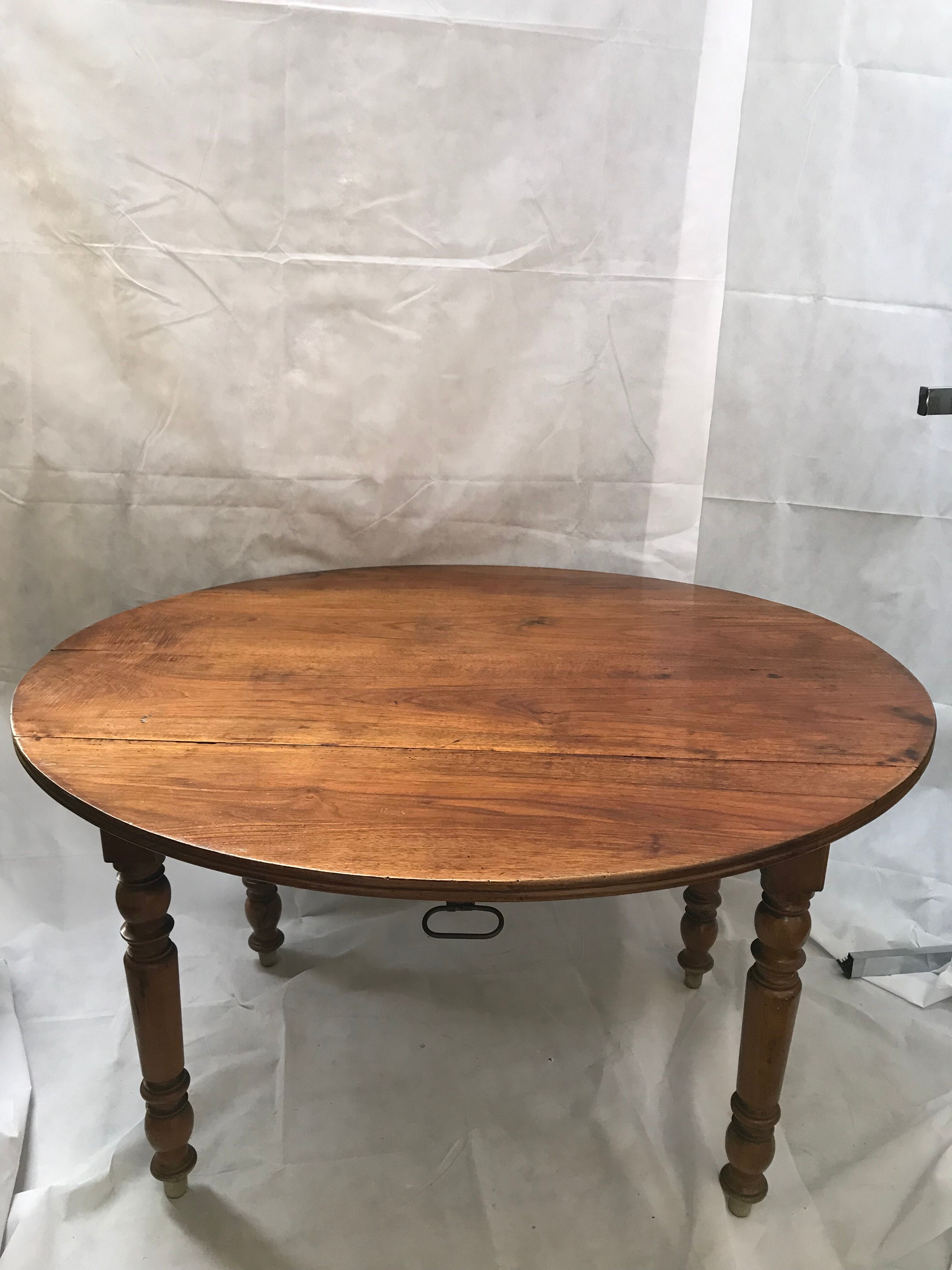 Oval wooden table with shutter