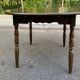 Extendable round table in solid wood with a dark oak satin finish.