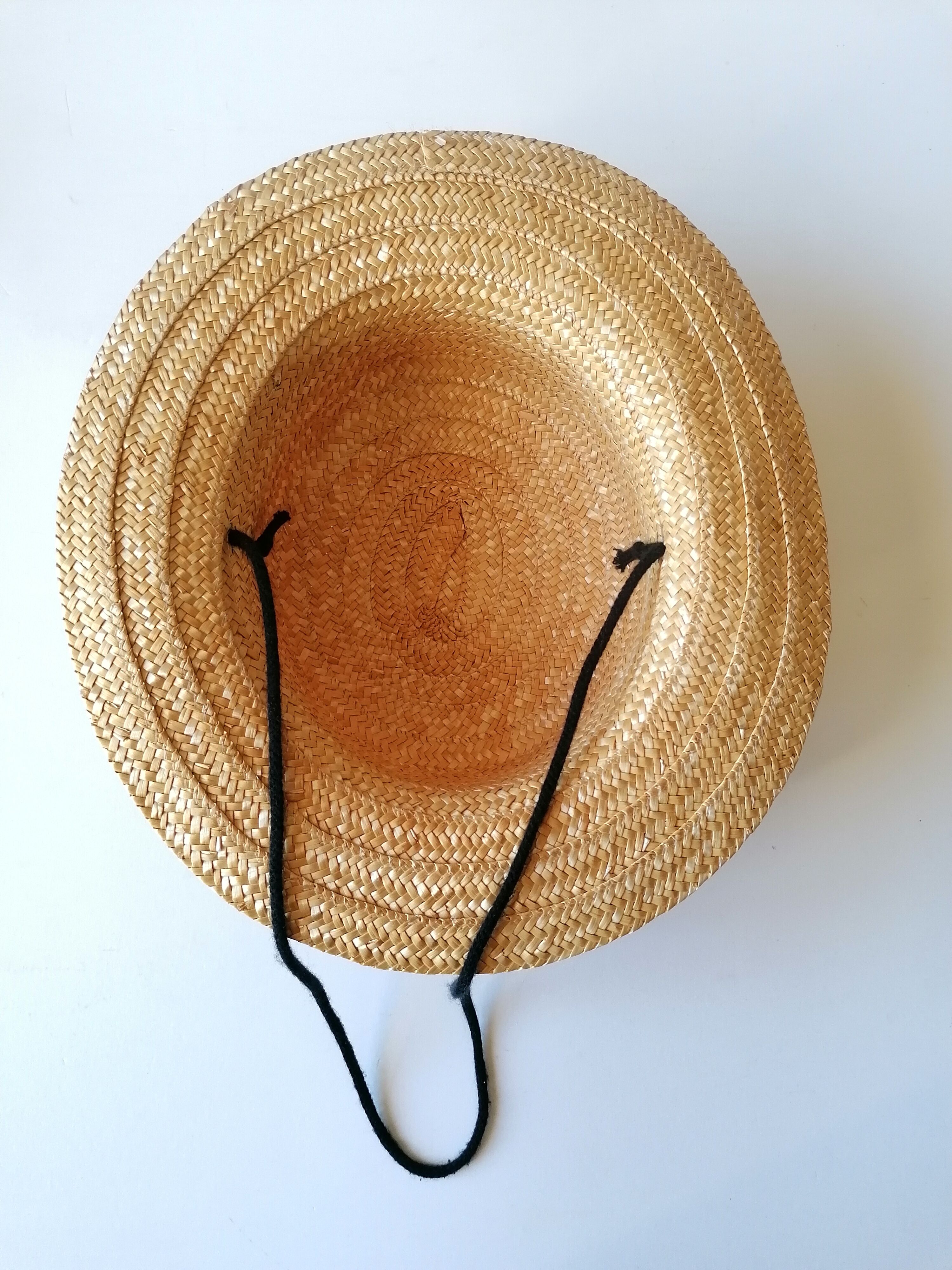 Canoe hat made of woven straw