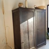 Old black wardrobe - wooden drawers and labels of origin