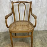 Curved wood and cane armchair